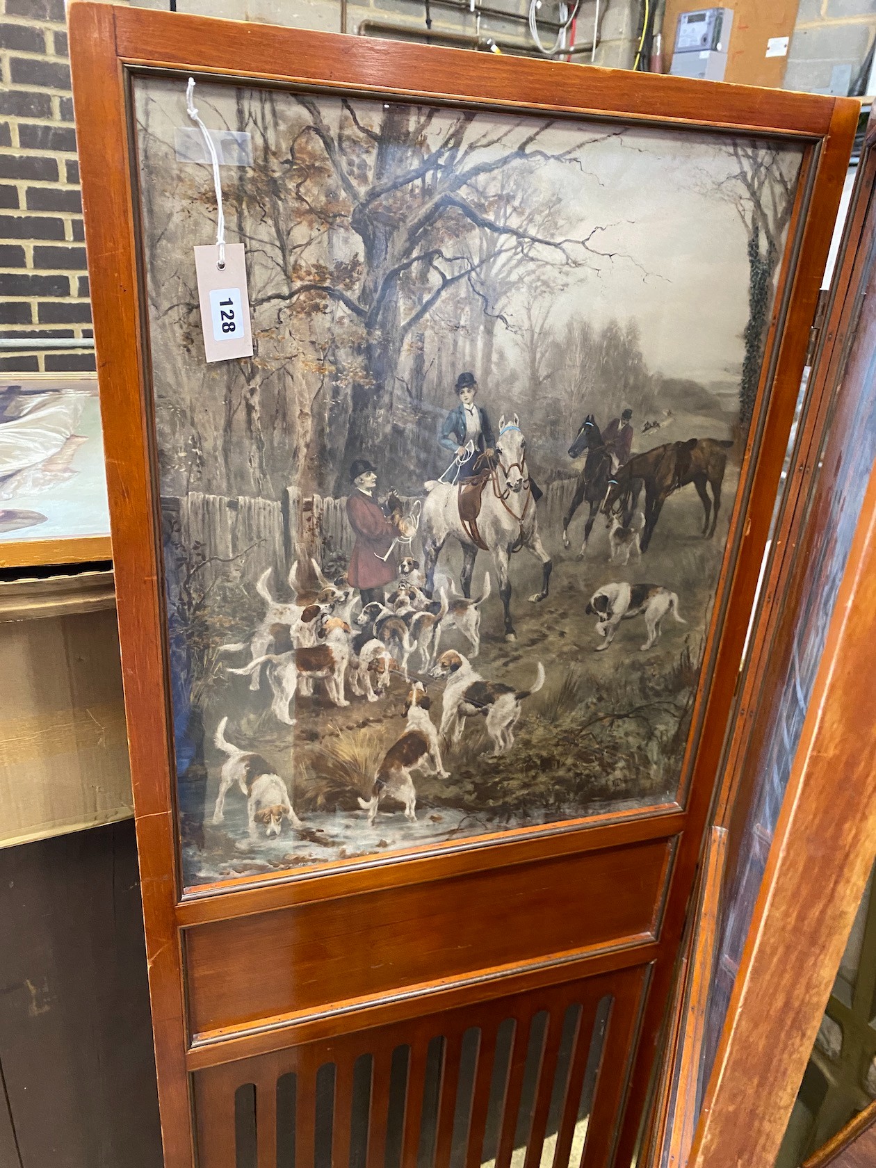 An Edwadian mahogany two fold screen inset with printed hunting scenes, each panel width 54cm, height 156cm